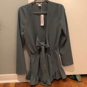 Never worn romper with tags on from LF!
